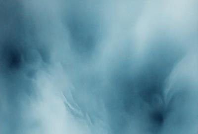 The primary subject of the image is a cloudy sky. The setting is a blue sky with clouds, creating a dramatic and moody atmosphere. The visual style is a photo, capturing the beauty of the cloudy sky. The colors and mood are predominantly blue, with the clouds adding depth and contrast to the scene.