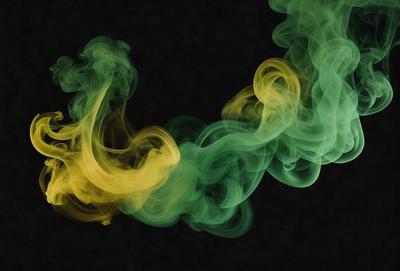 The primary subject of the image is a yellow and green smoke or vapor, which appears to be a part of a larger, more complex pattern. The setting is a dark background, which contrasts with the bright colors of the smoke. The visual style of the image is a combination of photo and digital art, creating a unique and intriguing appearance. The colors and mood of the image are predominantly yellow and green, with a slightly mysterious and captivating atmosphere.