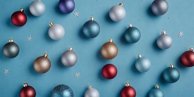 The primary subject of the image is a collection of Christmas ornaments, which are displayed on a blue wall. The ornaments come in various colors, including red, gold, and silver. The setting is indoors, likely in a home or a festive event space. The visual style is a combination of photo and digital art, as the ornaments are arranged in a visually appealing manner. The colors and mood of the image are festive and joyful, as the ornaments are associated with the holiday season.