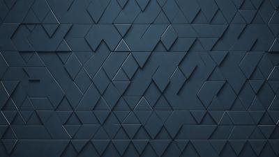 The primary subject of the image is a blue tile wall with a geometric pattern. The setting is a room with a blue tile wall as the main focus. The visual style is a close-up of the blue tile wall, showcasing the intricate pattern. The dominant colors are blue and black, creating a modern and sophisticated atmosphere.