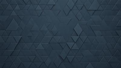 The primary subject of the image is a blue wall with a pattern of triangles. The setting is a room with a blue wall, and the visual style is a close-up of the wall. The dominant colors are blue and white, creating a calm and soothing atmosphere.