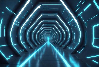 The primary subject of the image is a long, narrow tunnel with a blue lighting effect. The tunnel appears to be a futuristic, high-tech environment. The setting/background consists of a blue-lit tunnel with a row of blue lights on the walls. The visual style is a futuristic, digital art, or illustration. The colors and mood are predominantly blue, creating a sense of depth and a futuristic atmosphere.