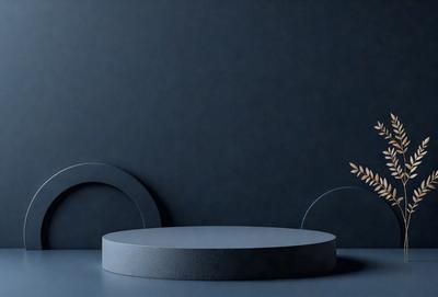 The primary subject of the image is a round table with a blue surface. The table is placed against a blue wall, which serves as the setting or background. The visual style of the image is a photo, capturing the details of the table and the wall. The colors and mood of the image are predominantly blue, creating a calm and serene atmosphere.