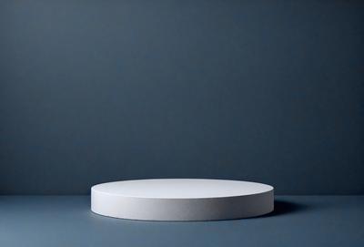The primary subject of the image is a white, round, flat object, which appears to be a piece of art or a decorative item. The setting is a blue background, which provides a contrasting and visually appealing backdrop for the object. The visual style of the image is a close-up, focusing on the details of the white object. The colors and mood of the image are predominantly blue, creating a calm and serene atmosphere.