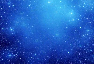 The primary subject of the image is the night sky filled with stars. The setting is a dark, star-filled background, creating a sense of depth and space. The visual style is a photo of the night sky, capturing the beauty of the stars and the vastness of the universe. The colors and mood of the image are predominantly dark and serene, with the stars providing a sense of wonder and tranquility.
