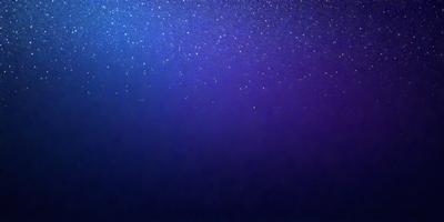 The primary subject of the image is the night sky, which is filled with stars. The setting is a dark, star-filled sky, and the visual style is a photo. The colors and mood of the image are predominantly dark and serene, with the stars providing a sense of wonder and tranquility.