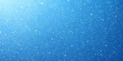 The primary subject of the image is a blue sky filled with stars. The setting is a clear night sky, and the visual style is a photo. The colors and mood of the image are predominantly blue, with the stars adding a touch of white.