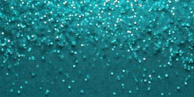 The primary subject of the image is a blue background with a pattern of glittering stars. The setting appears to be a deep blue ocean, with the stars creating a mesmerizing visual effect. The visual style of the image is a combination of a photo and digital art, as the stars are arranged in a way that resembles a painting or drawing. The colors and mood of the image are predominantly blue, with the glittering stars adding a touch of sparkle and excitement to the scene.