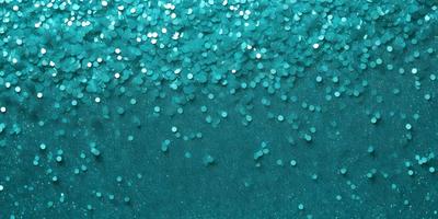 The primary subject of the image is a blue ocean with a few white stars scattered throughout the water. The setting is a vast, open ocean, and the visual style is a combination of a photo and digital art. The colors and mood of the image are serene and calming, with the blue ocean and white stars creating a peaceful atmosphere.