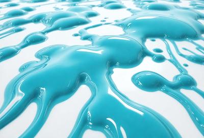 The primary subject of the image is a blue liquid, possibly a paint or a substance, spreading across a white surface. The setting appears to be a white table or a white background, which contrasts with the blue liquid. The visual style of the image is a close-up of the blue liquid, showcasing its texture and movement. The colors and mood of the image are predominantly blue, creating a sense of depth and tranquility.