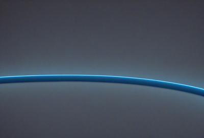 The primary subject of the image is a blue line, which appears to be a light or a beam of light. The setting is a gray background, which provides a contrasting and neutral backdrop for the blue line. The visual style of the image is a close-up, focusing on the blue line and its details. The colors and mood of the image are predominantly blue, creating a sense of calmness and tranquility.