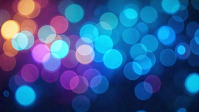 The primary subject of the image is a brightly colored, blue and purple light display. The setting is a dark background, which contrasts with the vibrant colors of the light display. The visual style of the image is a digital art or illustration, as it features a pattern of circles with a blue and purple hue. The colors and mood of the image are lively and energetic, creating a sense of excitement and movement.