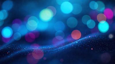 The primary subject of the image is a blue background with a pattern of bright, colorful lights. The setting appears to be a nighttime scene, with the lights creating a vibrant and lively atmosphere. The visual style of the image is a combination of digital art and illustration, as the lights are depicted in a way that resembles a digital artwork or a painting. The colors and mood of the image are predominantly blue and bright, with the lights adding a sense of energy and excitement to the scene.
