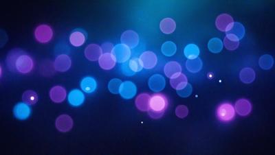 The primary subject of the image is a blue and purple light show, which appears to be a digital art or illustration. The setting is a dark background, and the visual style gives the impression of a futuristic or space-themed environment. The dominant colors in the image are blue and purple, creating a vibrant and lively atmosphere.
