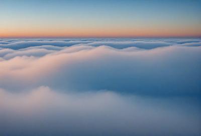 The primary subject of the image is a cloudy sky with a pinkish hue. The setting is a vast expanse of the sky, with no visible land or other objects. The visual style is a natural, outdoor scene, and the colors and mood convey a sense of tranquility and serenity.