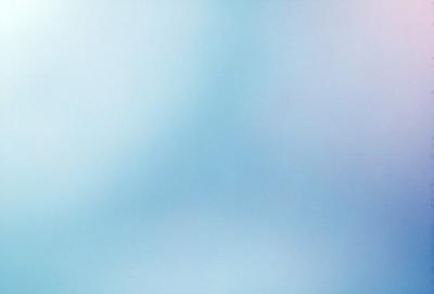 The primary subject of the image is a blue sky with clouds. The setting is a clear day with a cloudy sky, creating a serene atmosphere. The visual style is a natural, outdoor scene. The colors and mood are predominantly blue, with some white clouds, giving the image a calm and peaceful appearance.