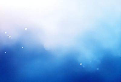 The primary subject of the image is a blue sky with clouds. The setting is a cloudy sky, and the visual style is a photo. The dominant colors are blue and white, creating a calm and serene atmosphere.