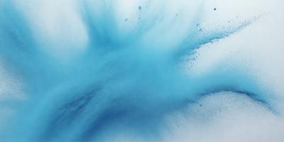 The primary subject of the image is a blue splash of paint or a blue blob, which is the main focus of the image. The setting is a white background, which provides a clean and uncluttered environment for the blue blob. The visual style of the image is a close-up of the blue blob, which emphasizes its shape and texture. The colors and mood of the image are predominantly blue, creating a calm and serene atmosphere.