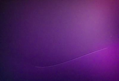 The primary subject of the image is a purple wall with a white line on it. The setting is a room with a purple background. The visual style is a digital art or illustration, creating a unique and artistic appearance. The dominant colors are purple and white, giving the image a calm and soothing atmosphere.