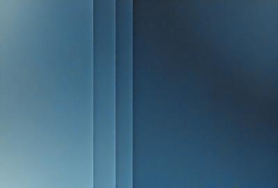 The primary subject of the image is a blue wall. The setting is a room with a blue wall, and the visual style is a photo. The dominant colors are blue, and the overall atmosphere is calm and serene.