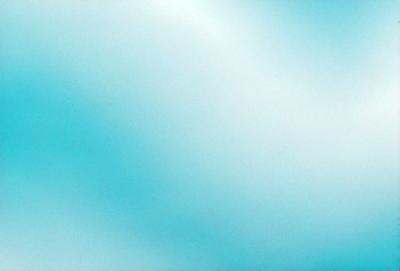 The primary subject of the image is a blue sky with clouds. The setting is a clear day with a cloudy sky, and the visual style is a natural, outdoor scene. The colors and mood of the image are predominantly blue, creating a calm and serene atmosphere.