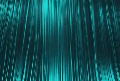 The primary subject of the image is a blue curtain or backdrop. The setting is a dark room, and the visual style appears to be a photo. The dominant colors are blue and green, creating a calm and serene atmosphere.