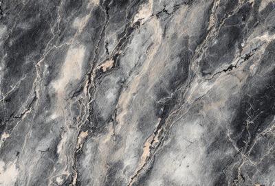 The image features a close-up of a marble surface with a pattern of lines and swirls. The marble appears to be grey and black in color, creating a visually striking and textured surface. The pattern of the lines and swirls adds depth and interest to the marble, making it an appealing and unique material.