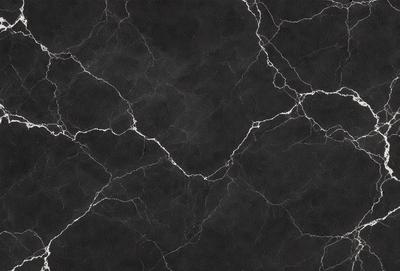 The primary subject of the image is a black marble countertop. The setting is a kitchen, with the countertop being the main focus of the scene. The visual style is a close-up of the marble countertop, showcasing its texture and details. The colors and mood of the image are predominantly dark, with the black marble countertop being the main source of contrast and visual interest.