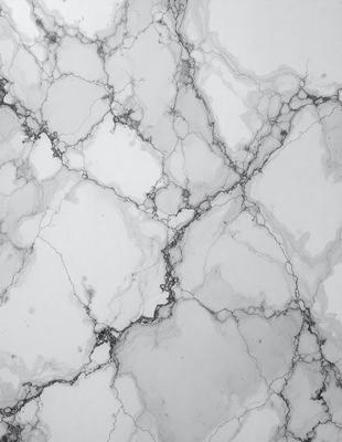 The image features a white marble wall with a pattern of holes and grooves. The wall appears to be a part of a building, possibly a bathroom or a kitchen. The marble surface gives the wall a unique and elegant appearance. The overall atmosphere of the image is clean and sophisticated, with the marble wall serving as a focal point.