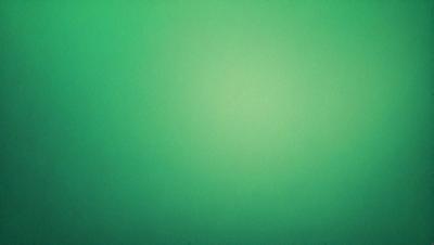 The primary subject of the image is a green background. The setting is a plain, empty space with no visible objects or people. The visual style is a close-up of the green background, which appears to be a pattern or texture. The colors and mood of the image are predominantly green, creating a calm and serene atmosphere.
