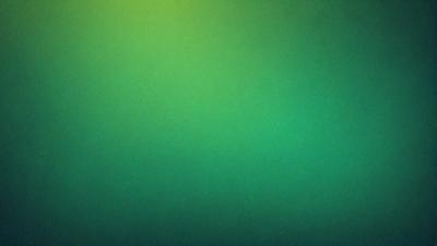 The primary subject of the image is a large, bright green wall. The setting is a dark room, and the visual style appears to be a photo. The dominant colors are green, and the overall atmosphere is vibrant and lively.