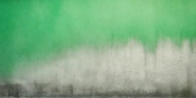 The primary subject of the image is a green wall with a white background. The setting appears to be a room with a green wall, and the visual style is a painting or drawing. The dominant colors are green and white, creating a calm and serene atmosphere.