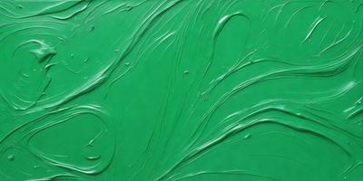 The primary subject of the image is a green painting with swirls and curves. The setting is a wall, and the visual style appears to be a painting or drawing. The dominant colors are green and white, creating a calm and soothing atmosphere.