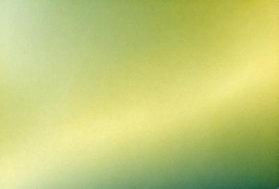 The primary subject of the image is a yellow wall. The setting is a room with a green background. The visual style is a photo, and the dominant colors are yellow and green. The overall atmosphere is bright and vibrant.
