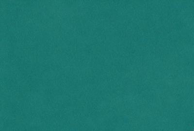 The primary subject of the image is a large, bright green surface. The setting is a dark blue background, creating a striking contrast between the two colors. The visual style appears to be a photo, as it captures the vibrant colors and textures of the green surface. The dominant colors are green and blue, creating a lively and energetic atmosphere.