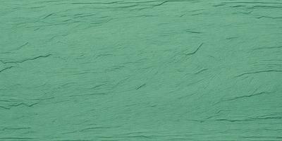 The primary subject of the image is a green background with a texture that resembles a piece of fabric. The setting is a close-up of the green fabric, showcasing its unique texture. The visual style is a close-up of the fabric, which gives the image a detailed and textured appearance. The colors and mood of the image are predominantly green, creating a calm and soothing atmosphere.
