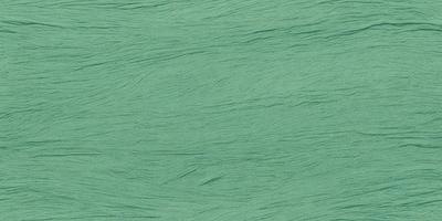 The primary subject of the image is a green fabric, which appears to be a piece of yarn or a knitted material. The setting is a green background, which complements the green fabric. The visual style is a close-up of the green fabric, showcasing its texture and details. The colors and mood of the image are predominantly green, creating a calm and soothing atmosphere.