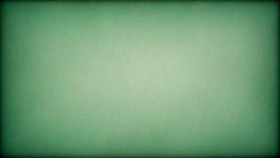 The primary subject of the image is a large, empty white space. The setting is a green background, which creates a contrast with the white space. The visual style is a simple, clean, and minimalist design. The colors and mood of the image are predominantly green, which gives it a calm and serene atmosphere.