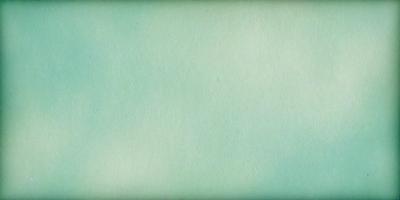 The primary subject of the image is a large, white sheet of paper. The setting is a room with a green background, which creates a calm and serene atmosphere. The visual style is a simple, clean line drawing, giving the image a minimalist and artistic appearance. The colors and mood are predominantly green, which adds a sense of tranquility and freshness to the scene.