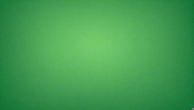 The primary subject of the image is a large, bright green wall. The setting is a plain, empty room with no other objects or people visible. The visual style is a close-up of the green wall, which gives a sense of depth and texture. The colors and mood of the image are predominantly green, creating a calm and serene atmosphere.