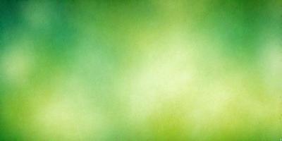 The primary subject of the image is a green background, which appears to be a painting or drawing. The setting is a large, open space with a vibrant green color. The visual style is artistic, with the background being the main focus of the image. The colors and mood are lively and energetic, creating a sense of freshness and vitality.