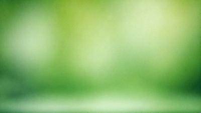 The primary subject of the image is a green background, which appears to be a grassy field. The setting is outdoors, with a natural environment visible. The visual style of the image is a photo, capturing the vibrant green color and the outdoor setting. The colors and mood of the image are predominantly green, creating a serene and peaceful atmosphere.
