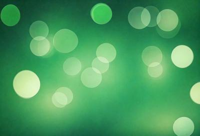 The primary subject of the image is a green background with a pattern of green and white lights. The setting appears to be a dark room, and the visual style is a digital art or illustration. The dominant colors are green and white, creating a calm and soothing atmosphere.