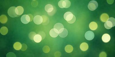 The primary subject of the image is a close-up of a green background with a pattern of bright, glowing lights. The setting appears to be a lush green field, and the visual style is a combination of a photo and digital art. The colors and mood of the image are predominantly green, with the bright lights adding a sense of energy and vibrancy to the scene.