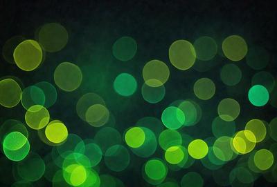 The primary subject of the image is a brightly lit green background with a pattern of green lights. The setting appears to be a dark room, and the visual style is a combination of a photo and digital art. The dominant colors are green, and the overall atmosphere is lively and vibrant.