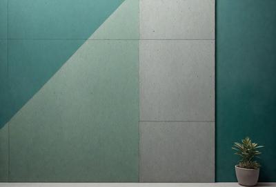 The primary subject of the image is a wall with a green and white color scheme. The setting is a room with a green and white wall, and the visual style appears to be a photo. The dominant colors are green and white, creating a calm and soothing atmosphere.