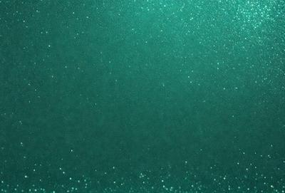 The primary subject of the image is a close-up of a green background with a glittery texture. The setting appears to be a dark room, and the visual style is a combination of a photo and digital art. The dominant colors are green and black, creating a moody atmosphere.