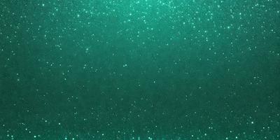 The primary subject of the image is a close-up of a green background with a pattern of glittering stars. The setting appears to be a dark room, and the visual style is a combination of a photo and digital art. The dominant colors are green and white, creating a calm and serene atmosphere.