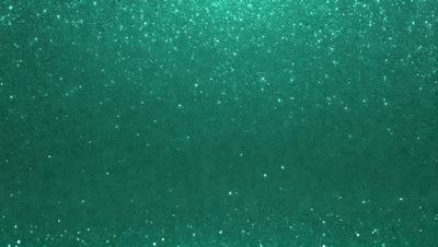 The primary subject of the image is a close-up of a green background with glittery, shiny, and sparkling elements. The setting appears to be a dark room, and the visual style is a combination of a photo and digital art. The dominant colors are green and shiny, creating a luminous and captivating atmosphere.