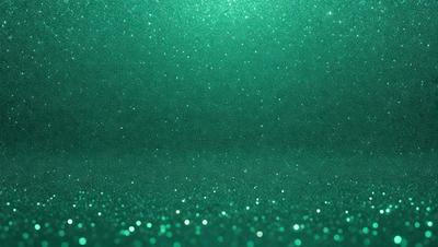 The primary subject of the image is a green background with a pattern of glittering stars. The setting appears to be a dark room, and the visual style is a combination of a photo and digital art. The colors and mood of the image are predominantly green, with a sense of depth and sparkle created by the stars.